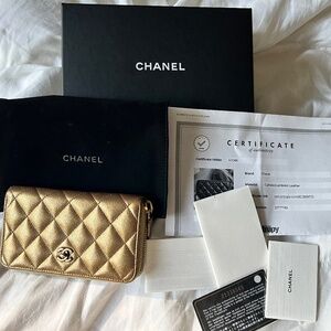 Authentic Chanel gold wallet lambskin medium zip around.